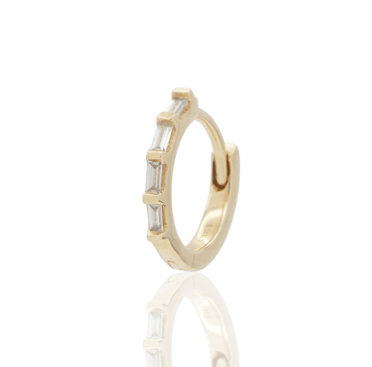Small gold hoop earring with elongated diamonds