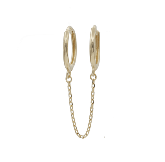 Double small gold hoop earrings connected with a delicate chain