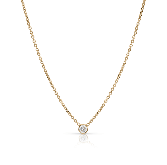 Bezel diamond baguette necklace and thin gold chain on white background