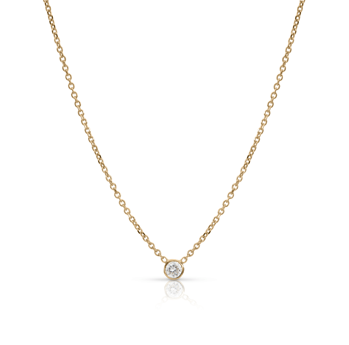 Bezel diamond baguette necklace and thin gold chain on white background