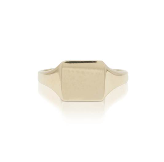 Gold signet square ring on a white background