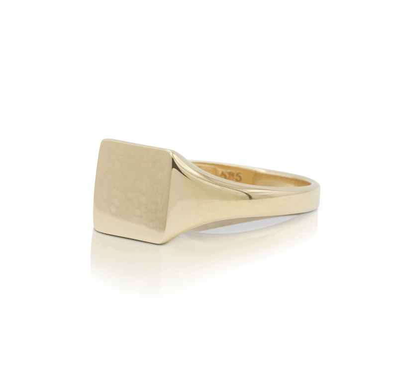 Side detail of gold signet heart ring