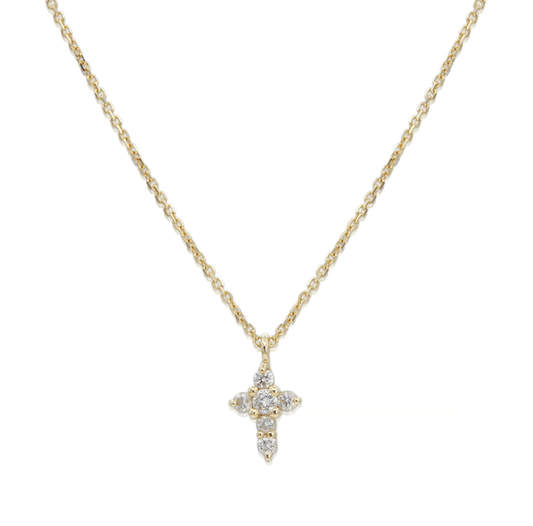 Tiny diamond cross pendant on a gold chain necklace