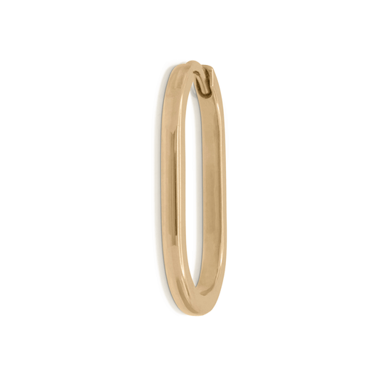 Long gold hoop earring on a white background