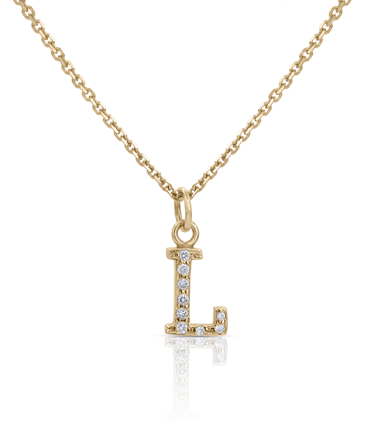 Gold letter charm pendant encrusted with diamonds and hung on a gold chain