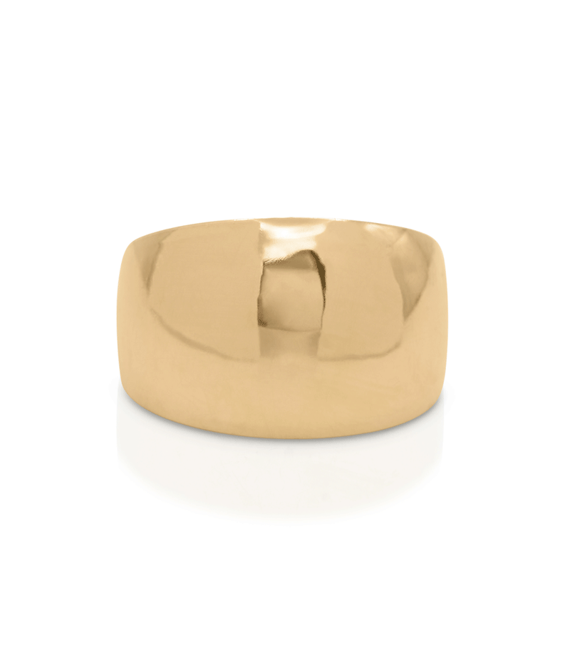 Shiny gold domed ring on a white background