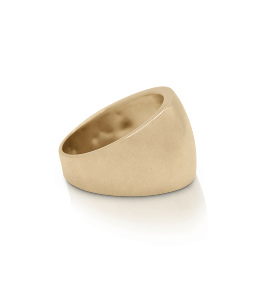 Chunky gold domed shape ring on a white background