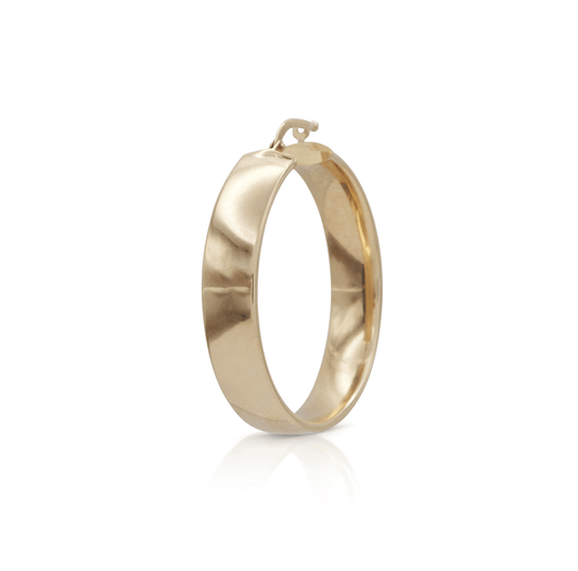 Thick gold wedding band-style hoop earring on a white background