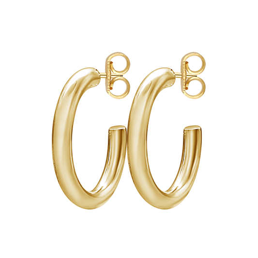 Set of gold hoop earrings on white background